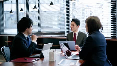 asian businessperson in a meeting.