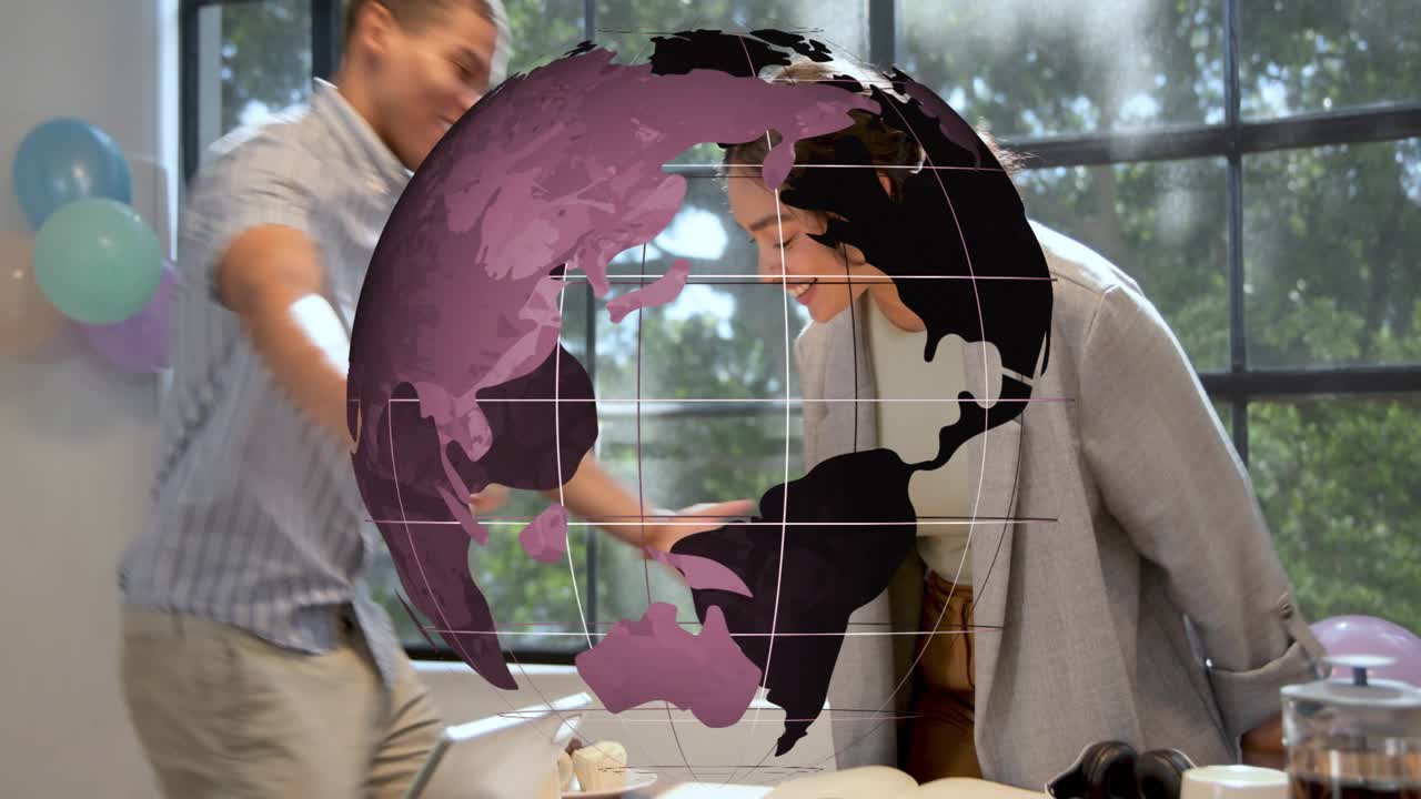 Male bringing plate initiating biz bash, female trying headset, globe centred over table, hugging