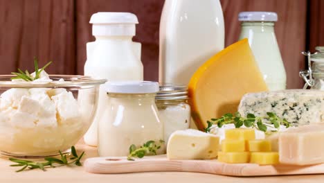 assorted dairy items arranged on a wooden surface