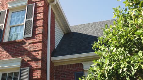 brick house exterior with grey roof