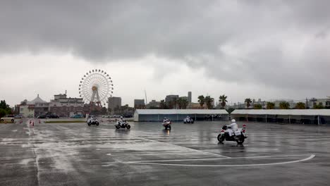 motorbikes riding dancing in a coordinated routine formation in a car park