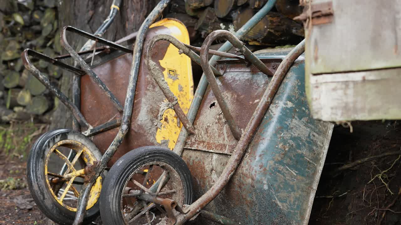 antique rusty garden wheelbarrows on the farm
