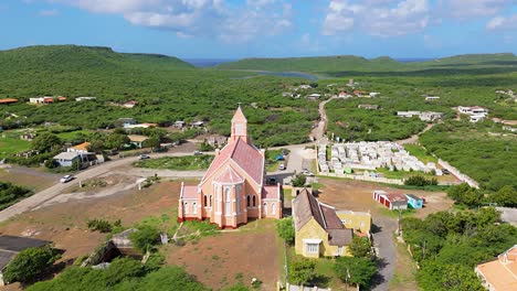 backside approach of church of sint willibrordus in curacao on sunny tropical day