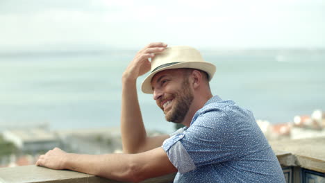 slow motion of happy man sitting on observation tower