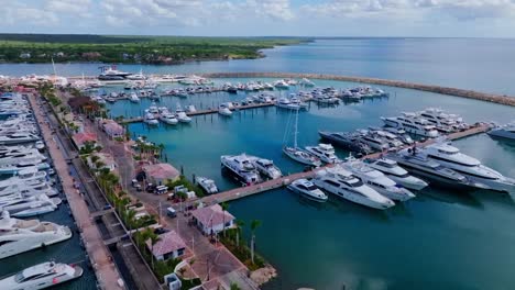 aerial flyover marina with luxury sailing boat and yachts in la romana, dominican republic