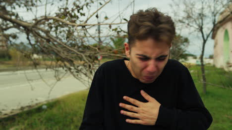 boy gags on vomiting after eating filthy food outdoor