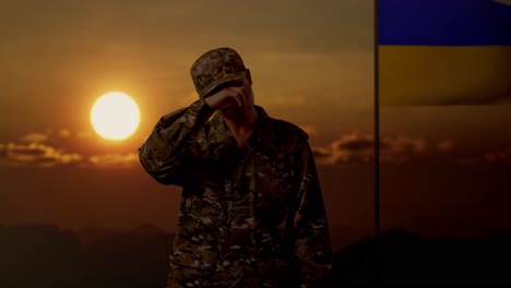 depressed ukrainian soldier at sunset