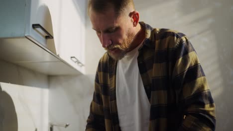 man cooking in kitchen