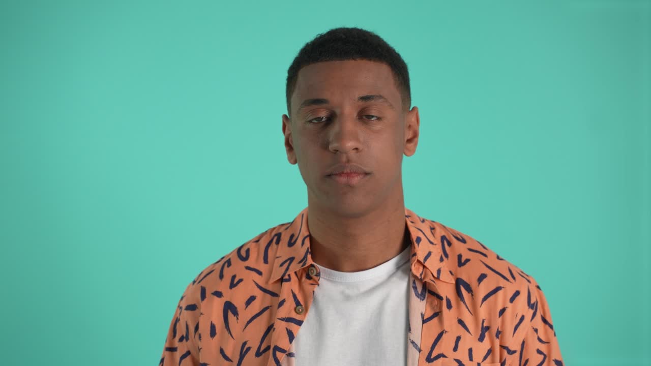 Falling asleep dark-skinned guy posing on camera