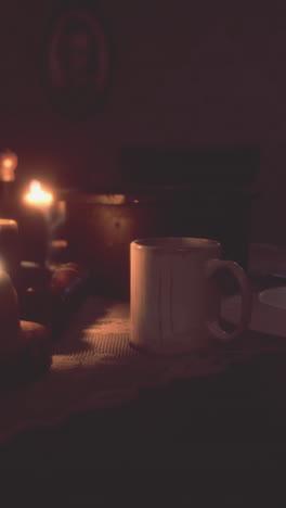 a cup of coffee by candlelight