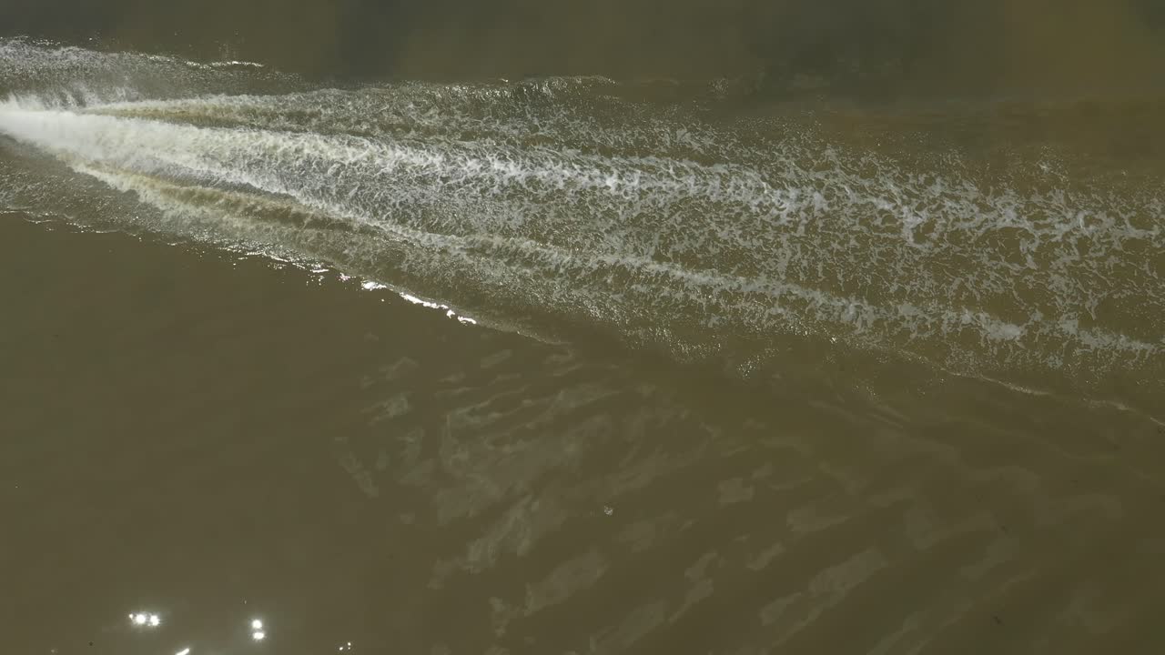 Top down shot of a blue speedboat on the Kenh Te Canal
