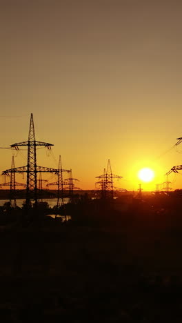 electricity transmission lines. distribution electric substation with power lines. vertical video