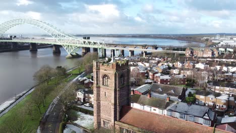 aerial view industrial small town frosty church rooftops neighbourhood north west jubilee bridge england right reveal