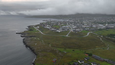 torshavn city faroe islands, cloudy day, aerial establishing tilt up