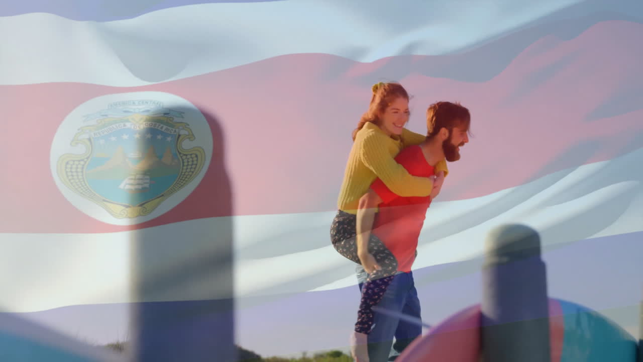 Young couple enjoying piggyback ride over waving Costa Rican flag animation