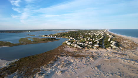 wide revealing drone shot of shoreline and beach homes at the point at emerald isle nc