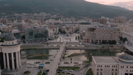 aerial view of skopje city center and vardar river at dusk