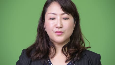 mature beautiful asian businesswoman covering mouth as three wise monkeys concept