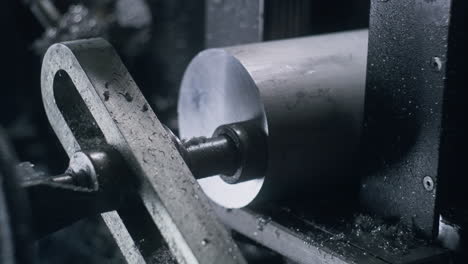 technician sets steel pipe in professional machine