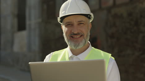engineer using laptop outdoors