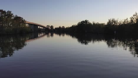 Droning-under-bridge-on-Cow-Bayou,-Texas