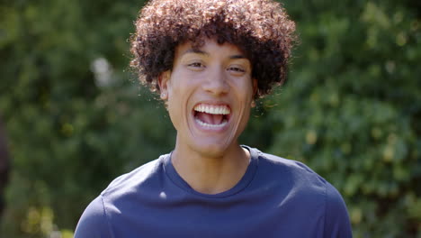 laughing joyfully, man enjoying outdoor hangout with multiracial male friends