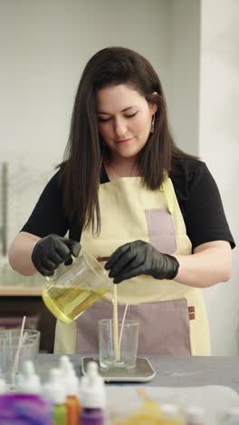 woman making candles