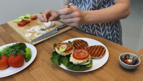 woman preparing homemade burgers