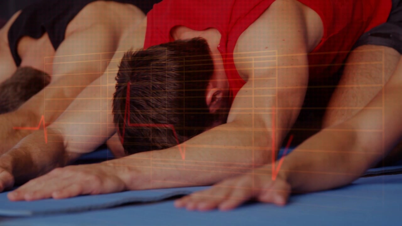 Yoga group exhaling, lowering into child stretch on blue mats calming, ECG pulsing over backs