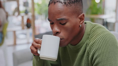 Black-man,-coffee-and-smile-sitting-on-sofa