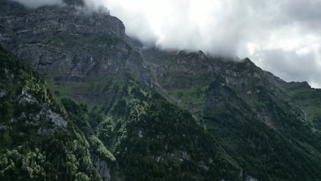 Majestic-rocky-terrain-with-cloud-covered-peaks-of-Swiss-Alps-in-Switzerland