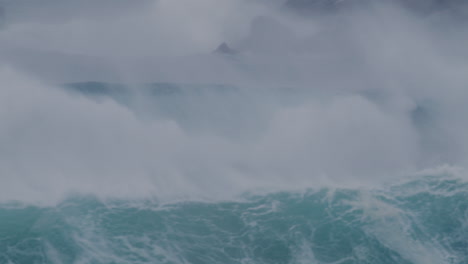 crashing waves in sydney, australia, with strong currents and deep blue ocean water swirling.