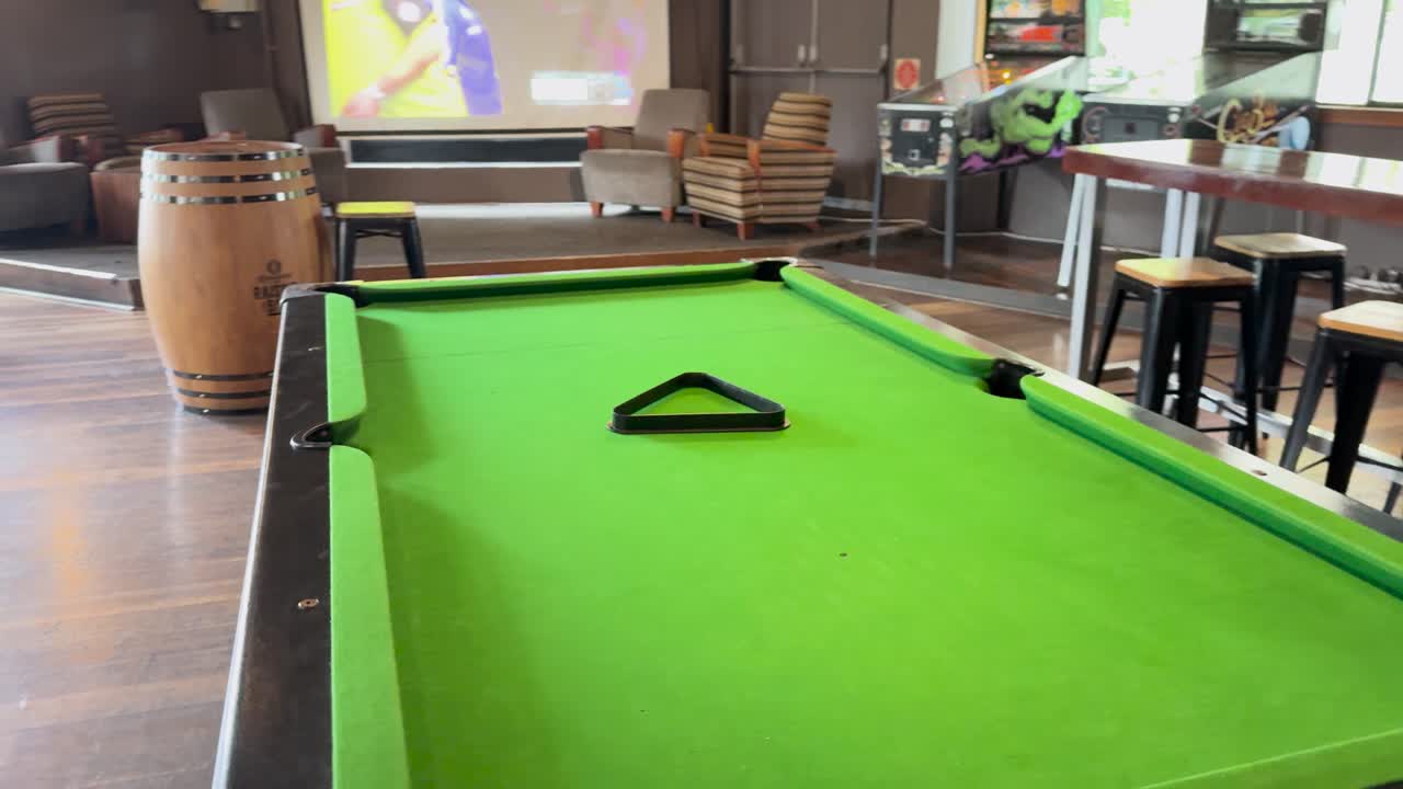 Unoccupied pool table in a sports bar