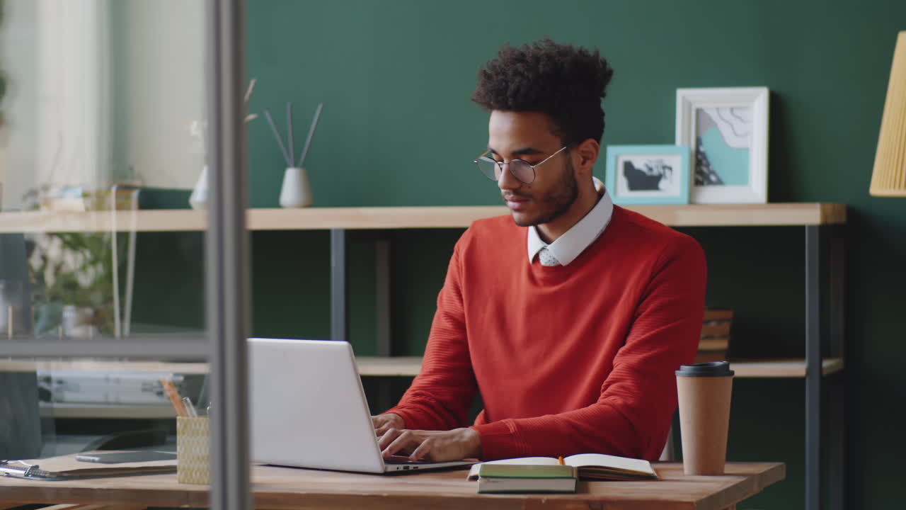 Young Man Working at a Modern Office