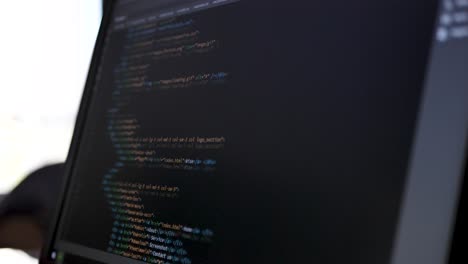 developer is browsing html code on the computer screen