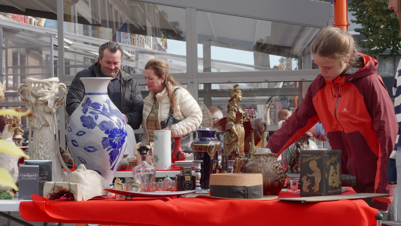 People Shopping at Local Antiques Market in Tongeren - Sunny Day