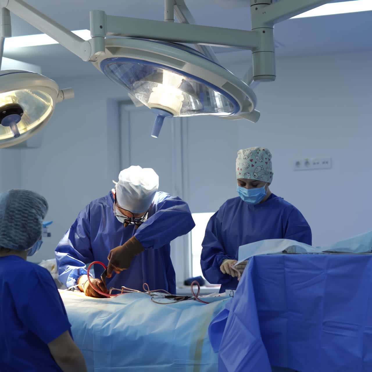 Doctors performing surgical operation. Surgeons collaborating to performing successful surgical operation
