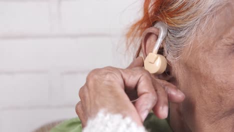 elderly woman with hearing aid