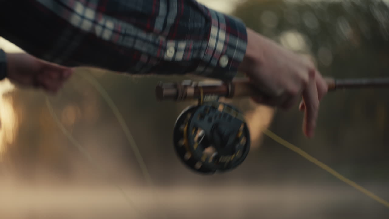 Man Fly Fishing at Sunset