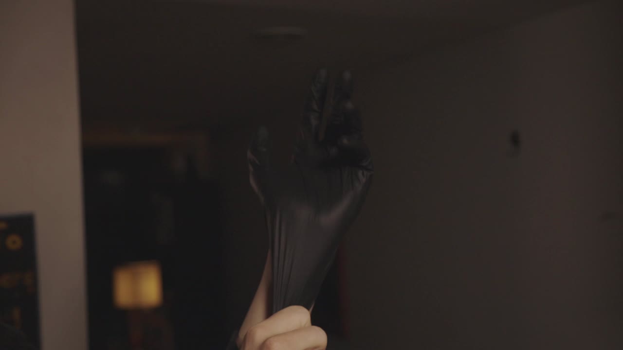 A Person Showing Proper Wearing Of A Gloves - Closeup Shot