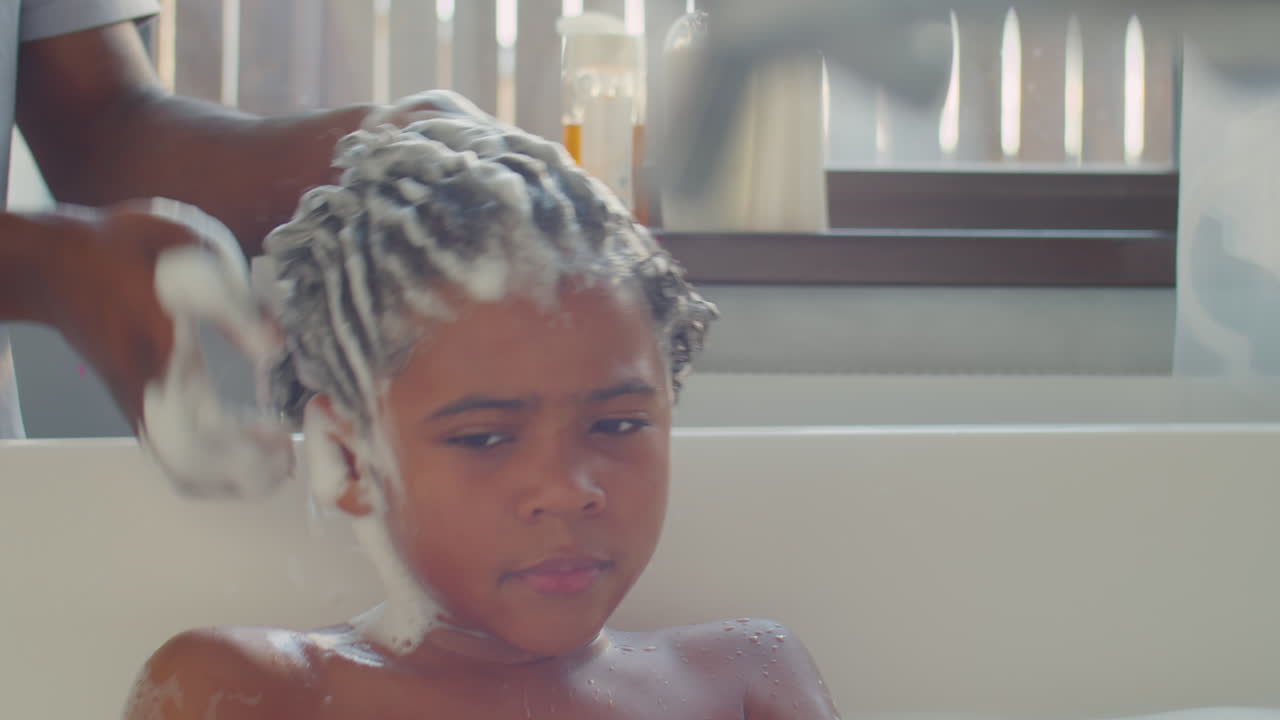 African American Kid Bathing with Dad