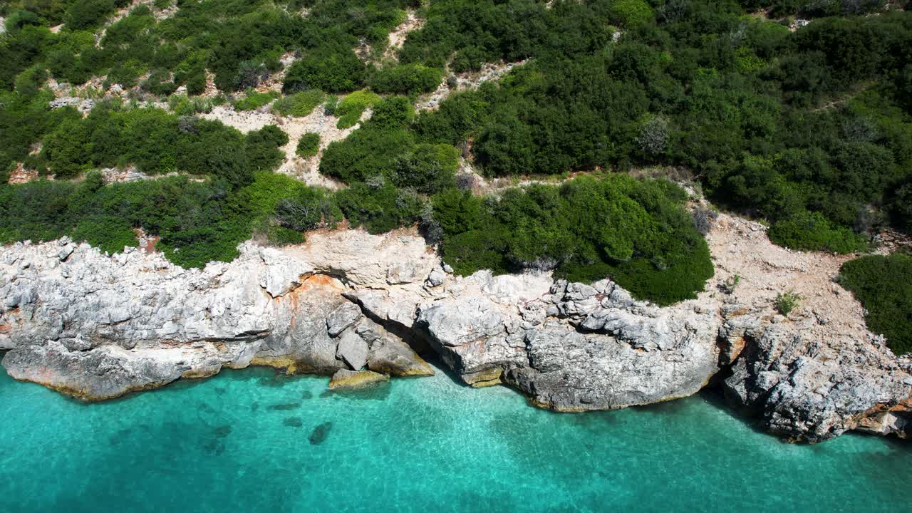 Hidden Bay with Turquoise Waters and Rocky Hills on Scenic Ionian Riviera of Albania