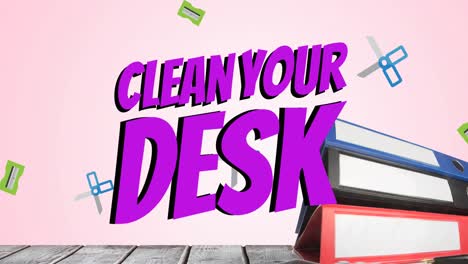 animation of clean your desk text over office files and scissors on wooden surface over pink