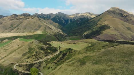 Aerial-panoramic-view-of-picturesque,-rugged-and-wild-mountain-ranges-at-Lake-Hawea-in-Otago,-South-Island-of-New-Zealand-Aotearoa