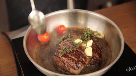 cooking steak in a pan