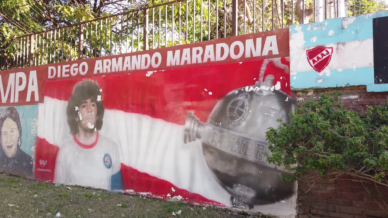 Panoramic at Diego Armando Maradona artwork portrait as young soccer player, footballer of Argentina