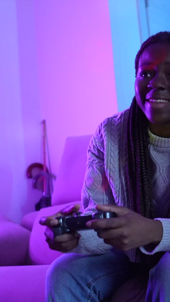 Two young women playing video games together