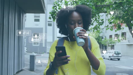 Animation-of-media-icons-over-african-american-woman-using-smartphone-in-city