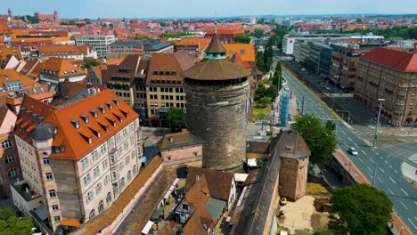 4k aerial drone video of ancient women's gate tower in downtown nurnberg, germany