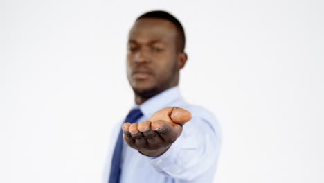 businessman gesturing against white background